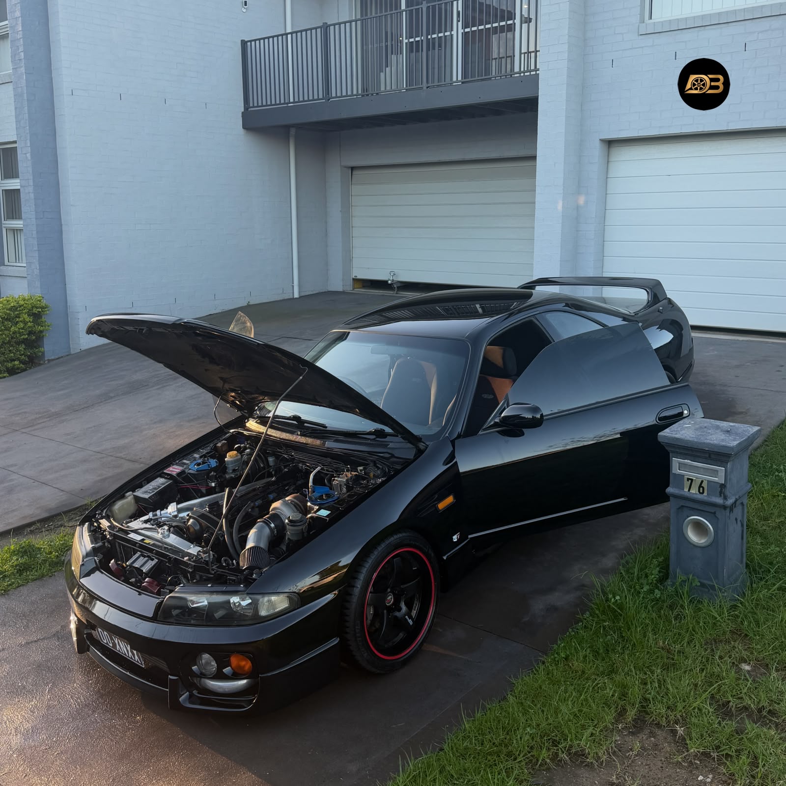 Glossy black performance car after detailing