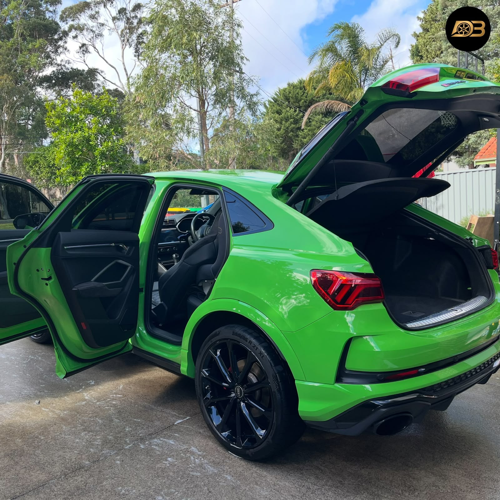 Green Audi SUV with high-gloss ceramic finish