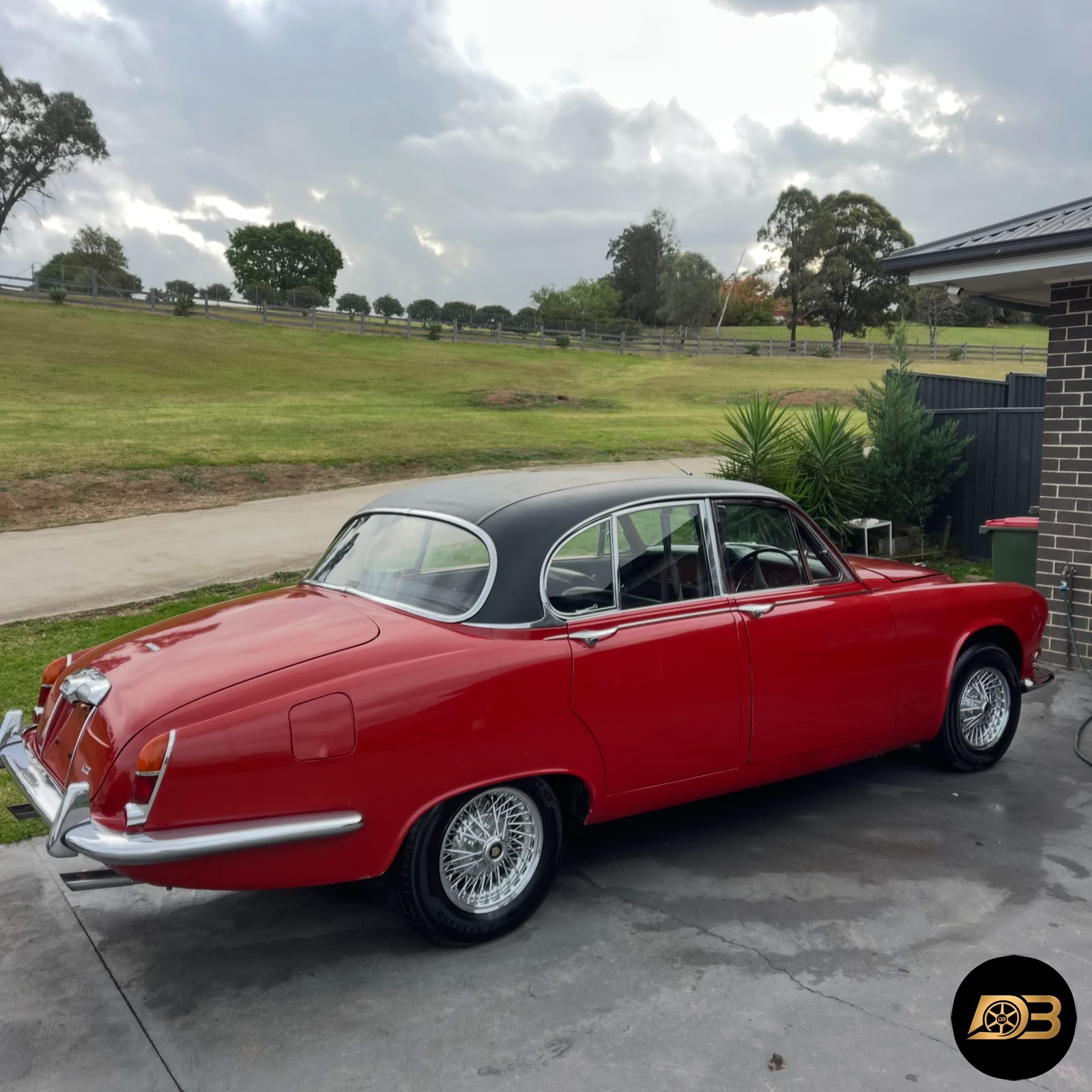 Classic red sedan after paint protection service